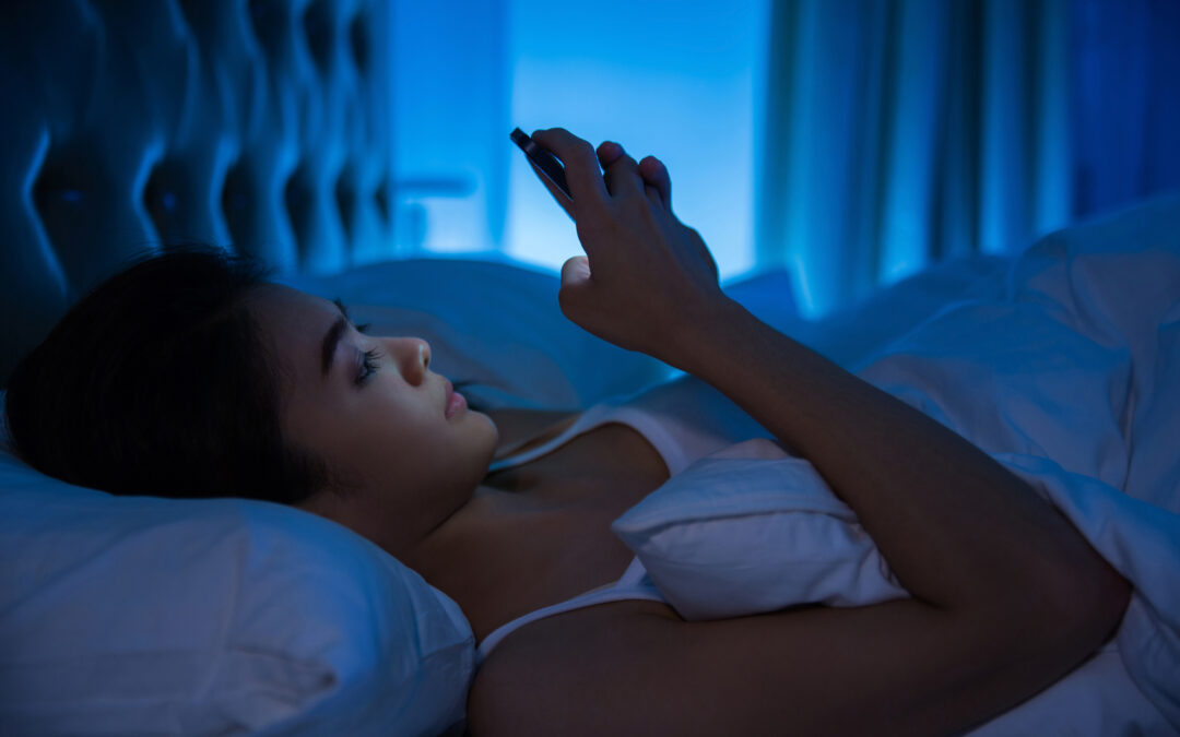 Picture of woman in bed on phone